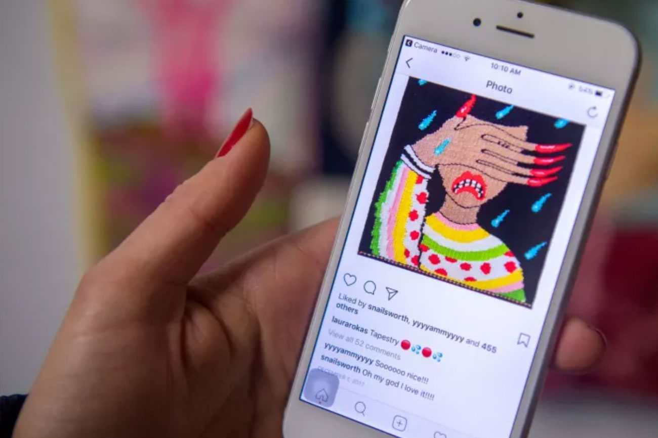 Laura Rokas posts a photo of her tapestry to Instagram. (Josh Edelson / For The Times)