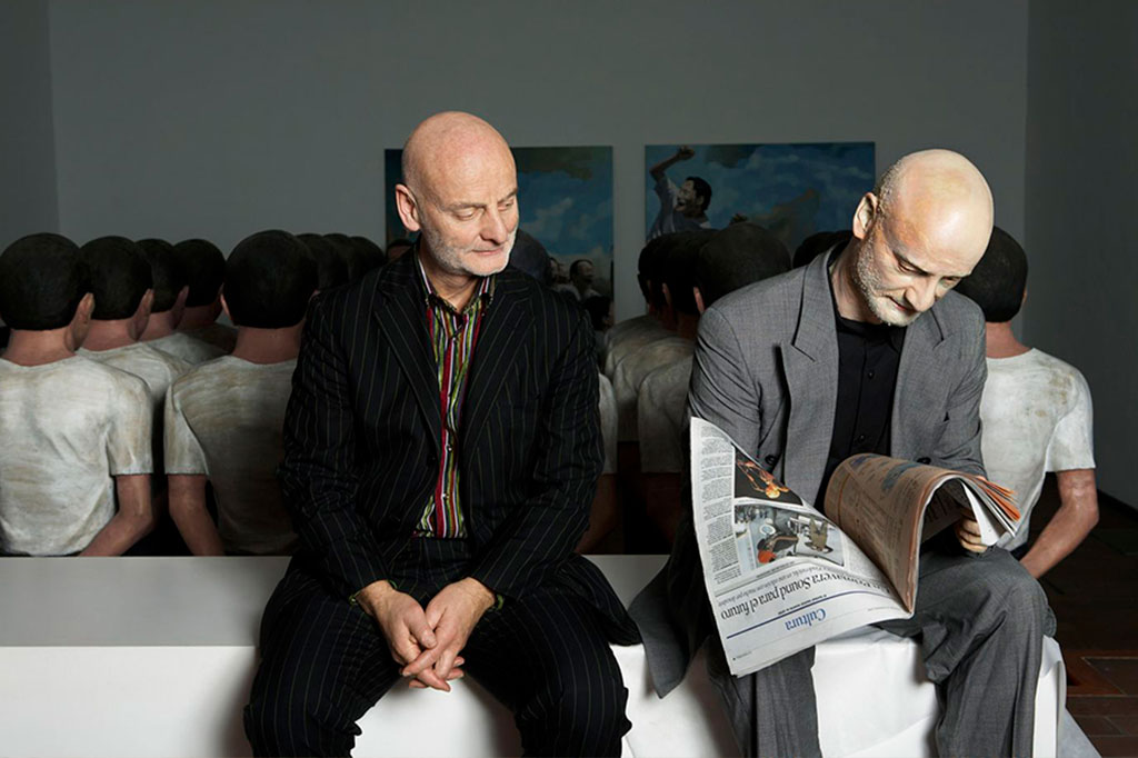 Uli Sigg with Ai Weiwei’s sculpture “Newspaper Reader.” Courtesy: M+ Sigg Collection